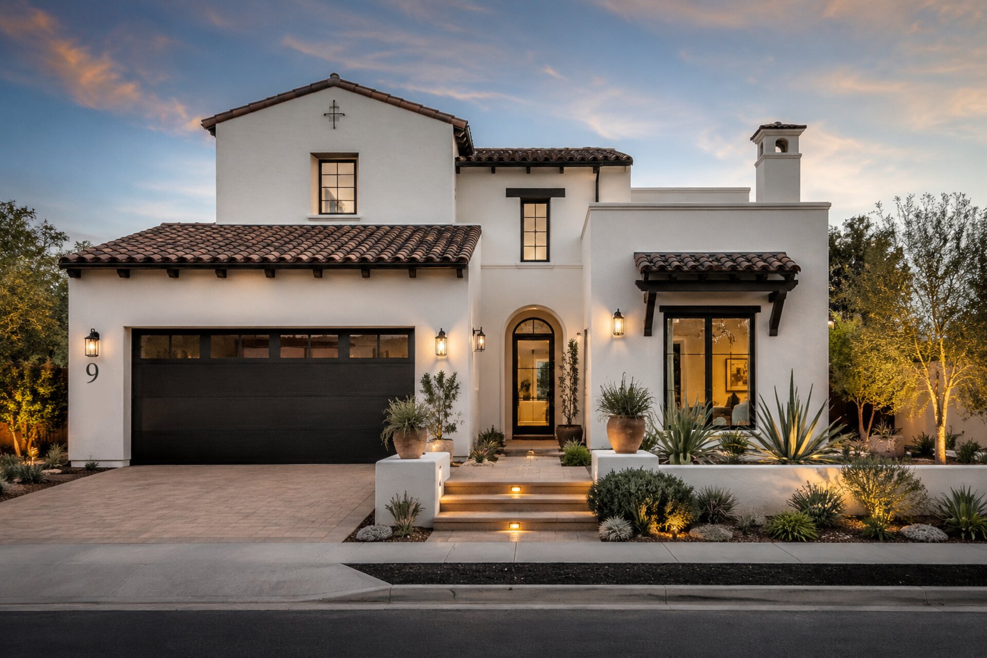 Modern Spanish-style custom home at dusk